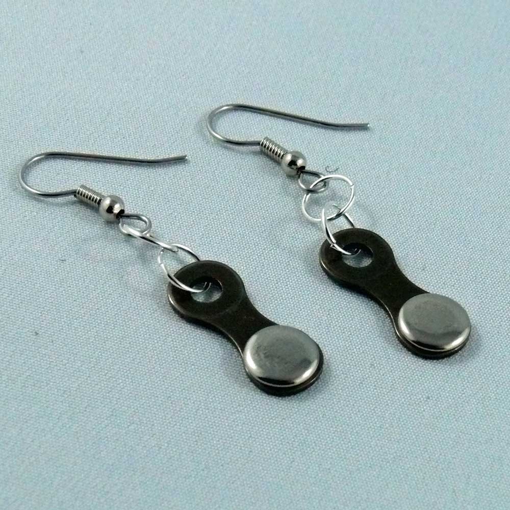 cycling bicycle chain dark with silver coloured cap bike jewelry