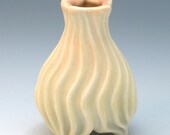 Carved yellow & peach porcelain bud vase