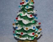 Handpainted ceramic Lighted Christmas Tree covered in little round multi colored bulbs and a yellow star with snow tipped branches - FlutterbyConnections