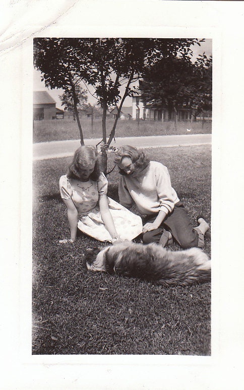 Great Vintage Photograph of two women playing with a dog