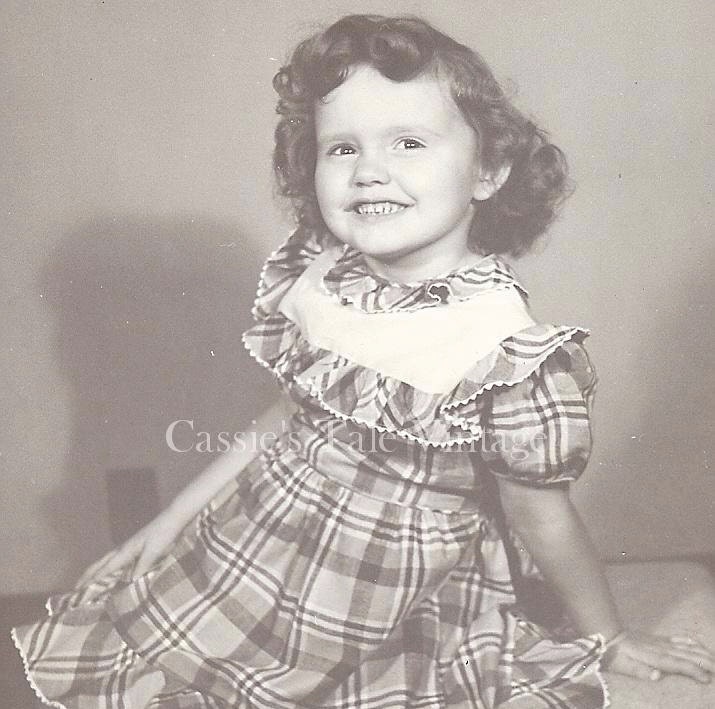 Vintage Photo - Adorable Little Girl w. Curly Brown Hair & Huge Hollywood Smile, Plaid Dress w. Puffy Sleeves and Ruffle Collar, c.1950s