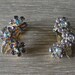 Vintage 1950s WEISS NY Aurora Borealis and Light Purple Rhinestone Clip On Flower Earrings with Gold Tone Leaves
