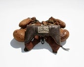 Vintage 1950s leather boxing gloves and headgear