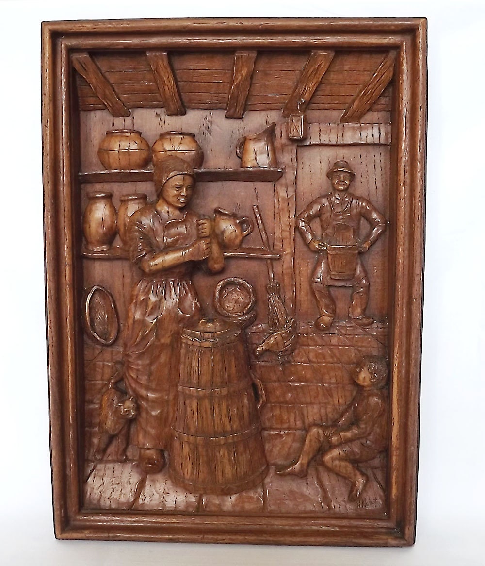 Wooden carved picture of a man and woman - French household scene