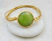 april fashion  olive apple green jade  large stone in gold frame gemstone handmade  bracelet gold leather cord israel jewelry