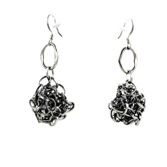 Stylish silver dangling earrings. Modern, versatile, abstract shape, original design