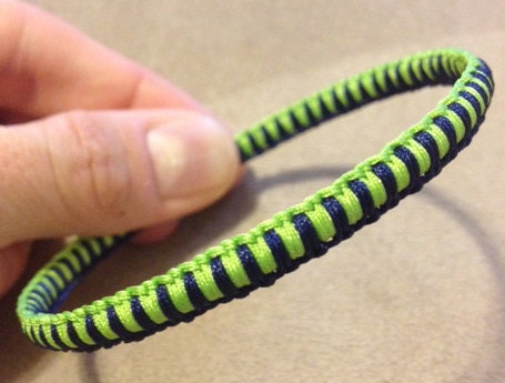 Macramé bangle - navy blue and lime green cord over metal bangle