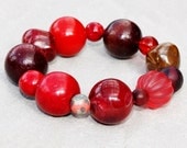 Chunky bracelet, oxblood bracelet, dark red, bright red, brown, wooden beads, bowerbird, contemporary