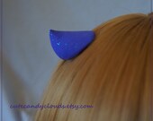 Purple sparkling clip on mini horns