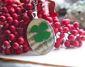 four leaf clover resin jewelry pressed flower necklace. pressed botanical Pendant on music