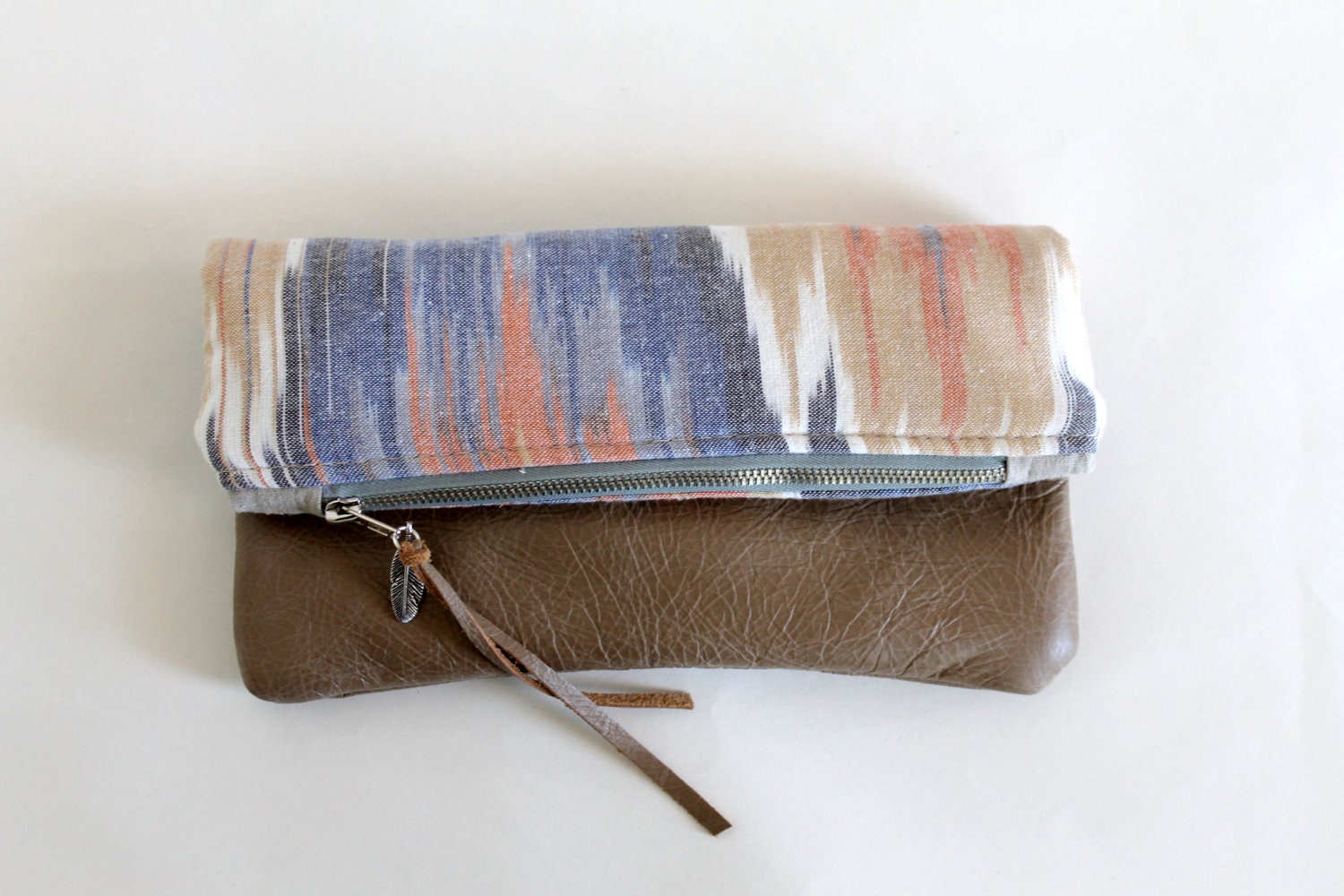 Ikat and leather fold over clutch