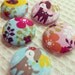 Five Fabric Covered Buttons in Girly Woodland Fabric with Deer, flowers and bird - great for cards, scrapbooking or hair ties.