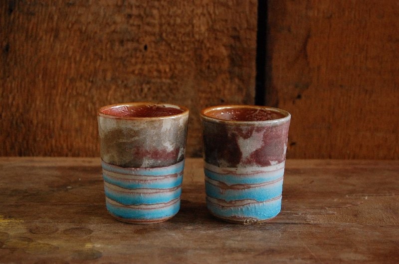 set of shino and turquoise whiskey cups