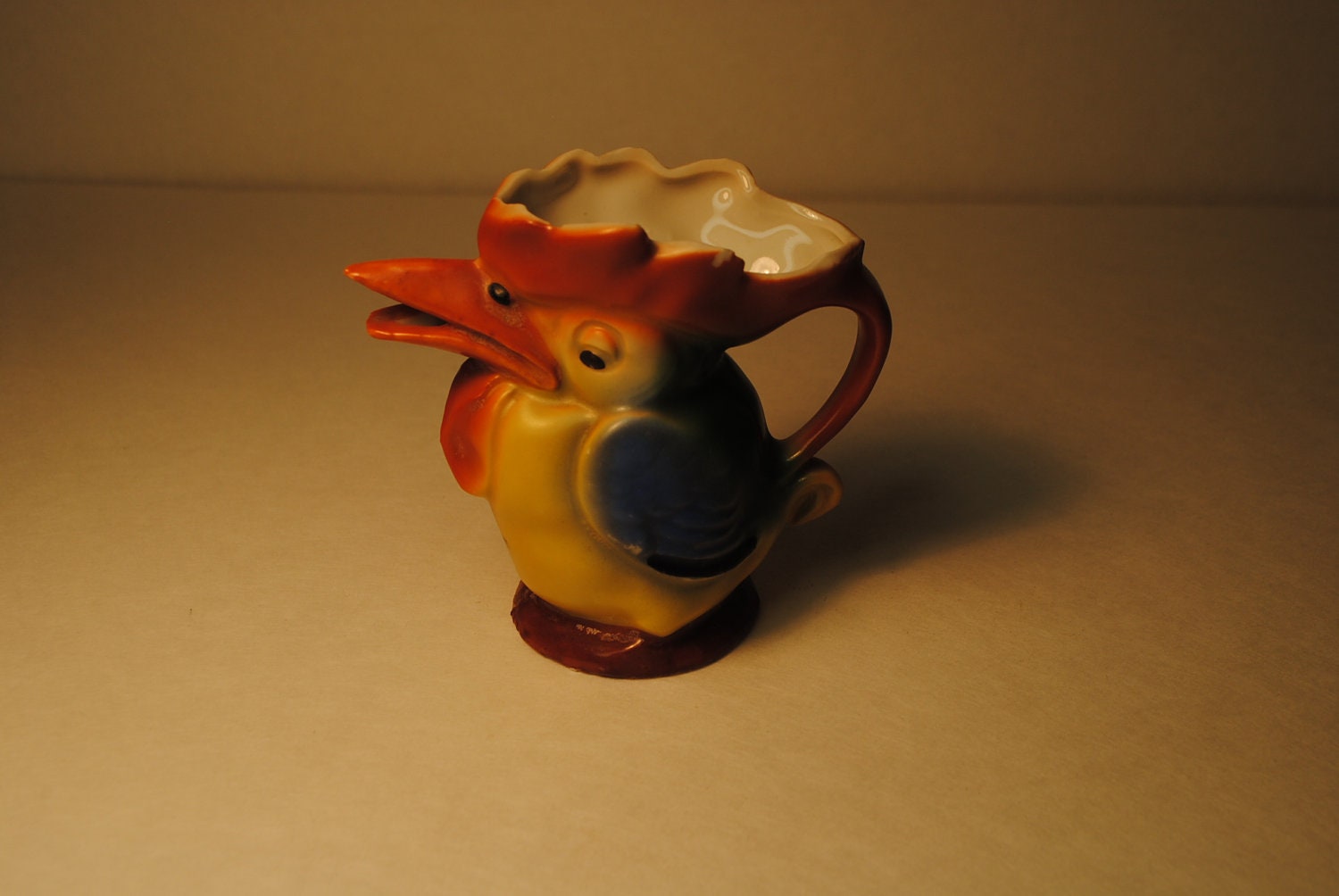 antique 1930s IRISH creamer TOUCAN which is associated with Guinness beer a lovley and rare find blue orange yellow