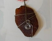 brown wire-wrapped sea glass pendant