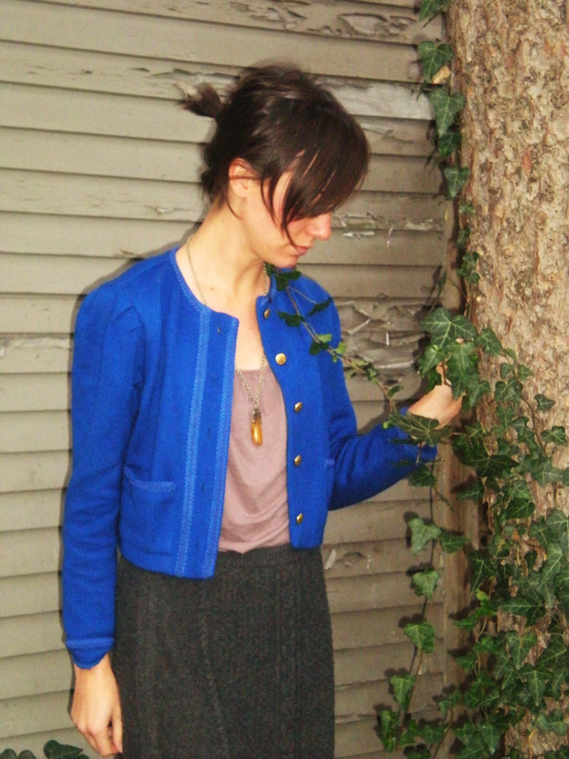Royal blue sweater jacket accented with pleated shoulders gold buttons and cord detailing size small