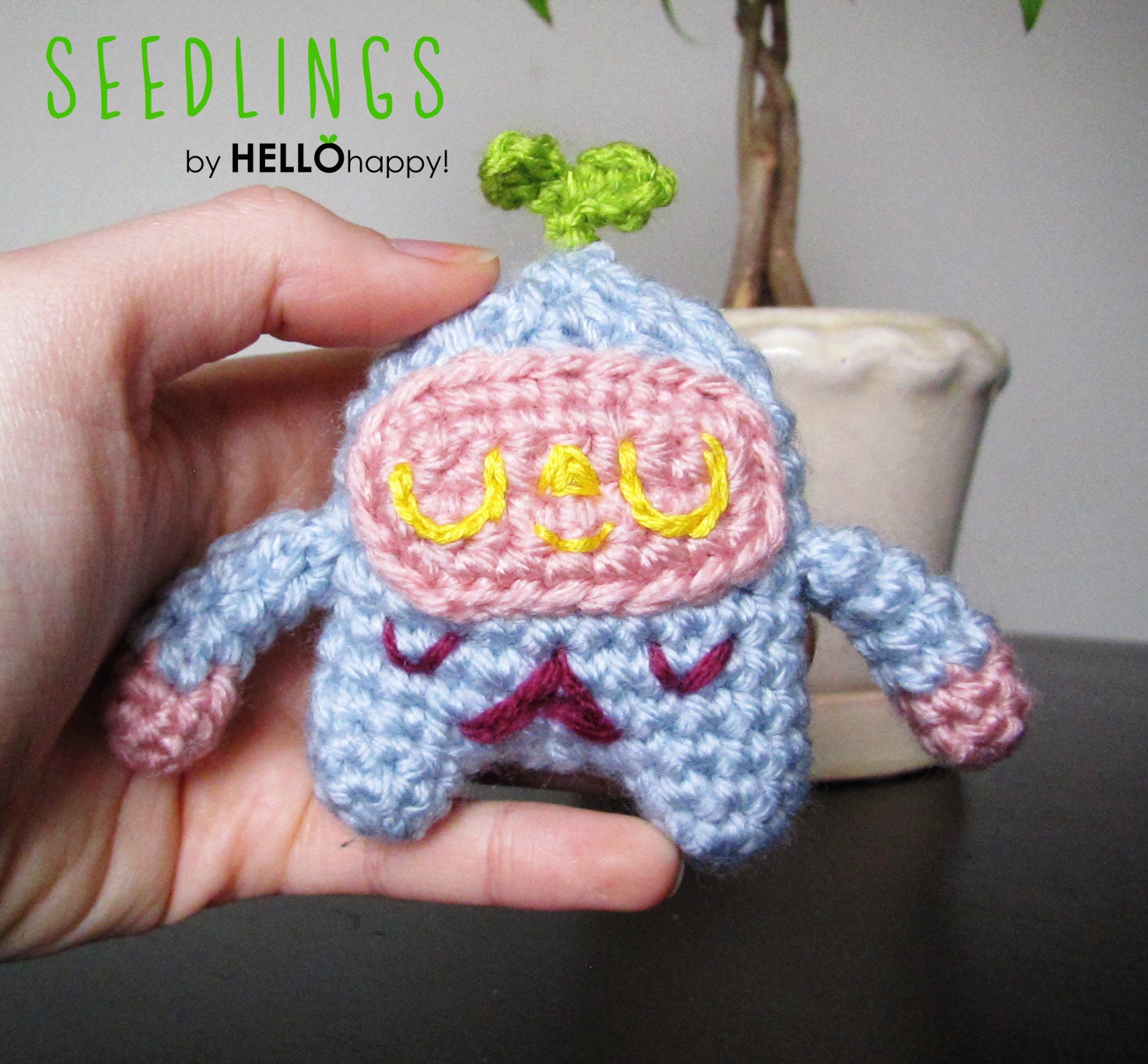 Seedling 005 - cute little amigurumi plant seedlings - light blue with pink and yellow and magenta and dark green leaves