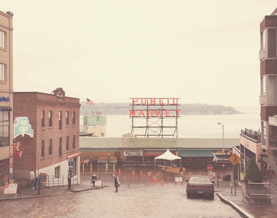 travel photography, downtown Seattle rainy landscape, Pike Place public market, gloomy gray, red sign, cobblestone, Pacific Northwest art
