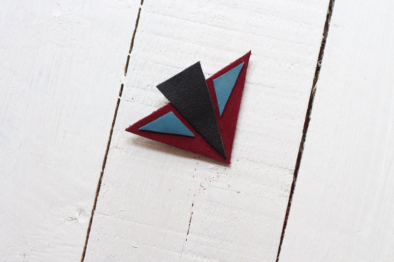 Geometric triangle leather brooch in burgundy, black and blue