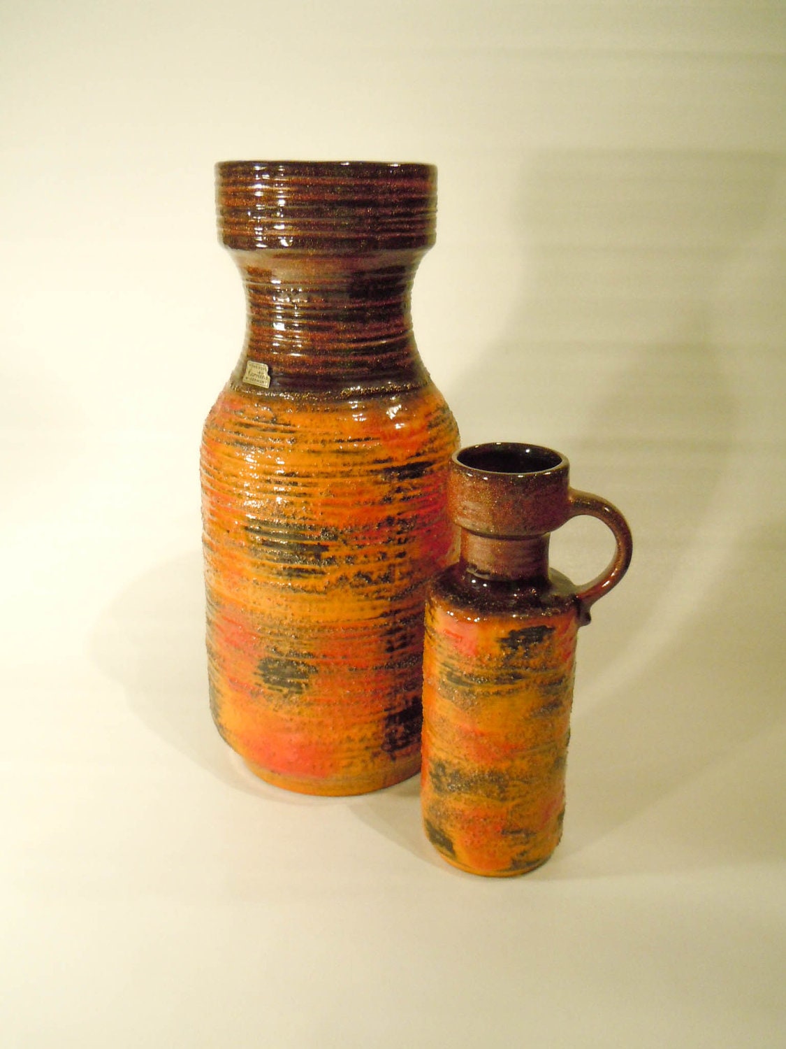 Small shiny and bright orange vase with ear and textured glaze, West Germany Carstens studio Tonnieshof