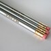 I am made of win. 3 three silver Self congratulatory pencils make writing and test taking fun again. halloween treats that won't rot teeth.