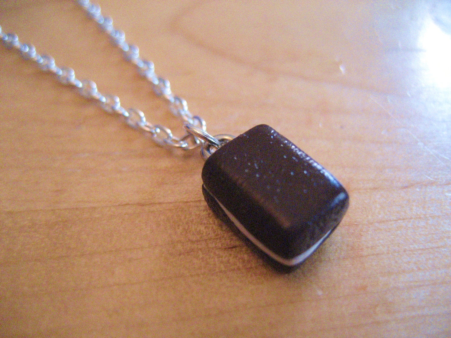 Suzy-Q snack cake necklace made from polymer clay