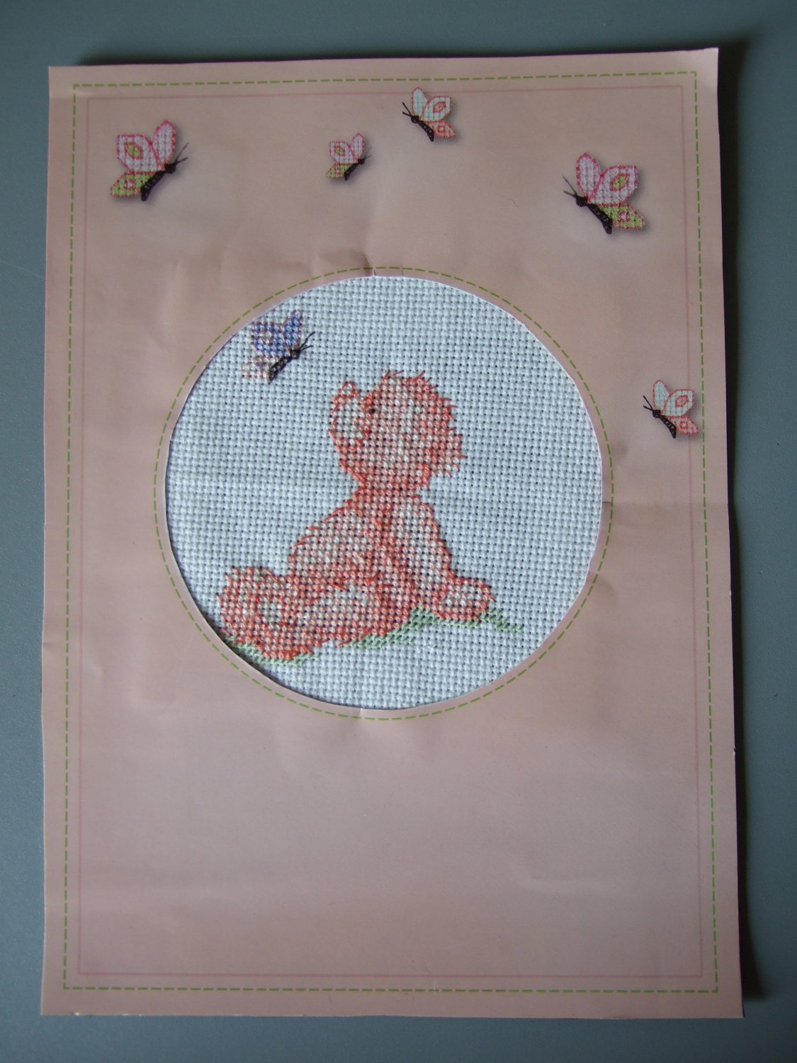 Baby cross stitch picture on paper mount.  Peach teddy bear with butterflies / Notice / Sign. Hand Made
