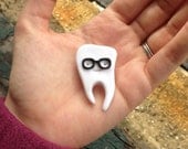 Spring and summer fun cute and nerdy hipster glasses wearing tooth brooch