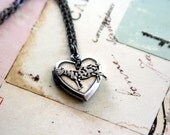 goat. locket necklace. silver ox color