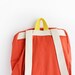 orange backpack with magenta pouch