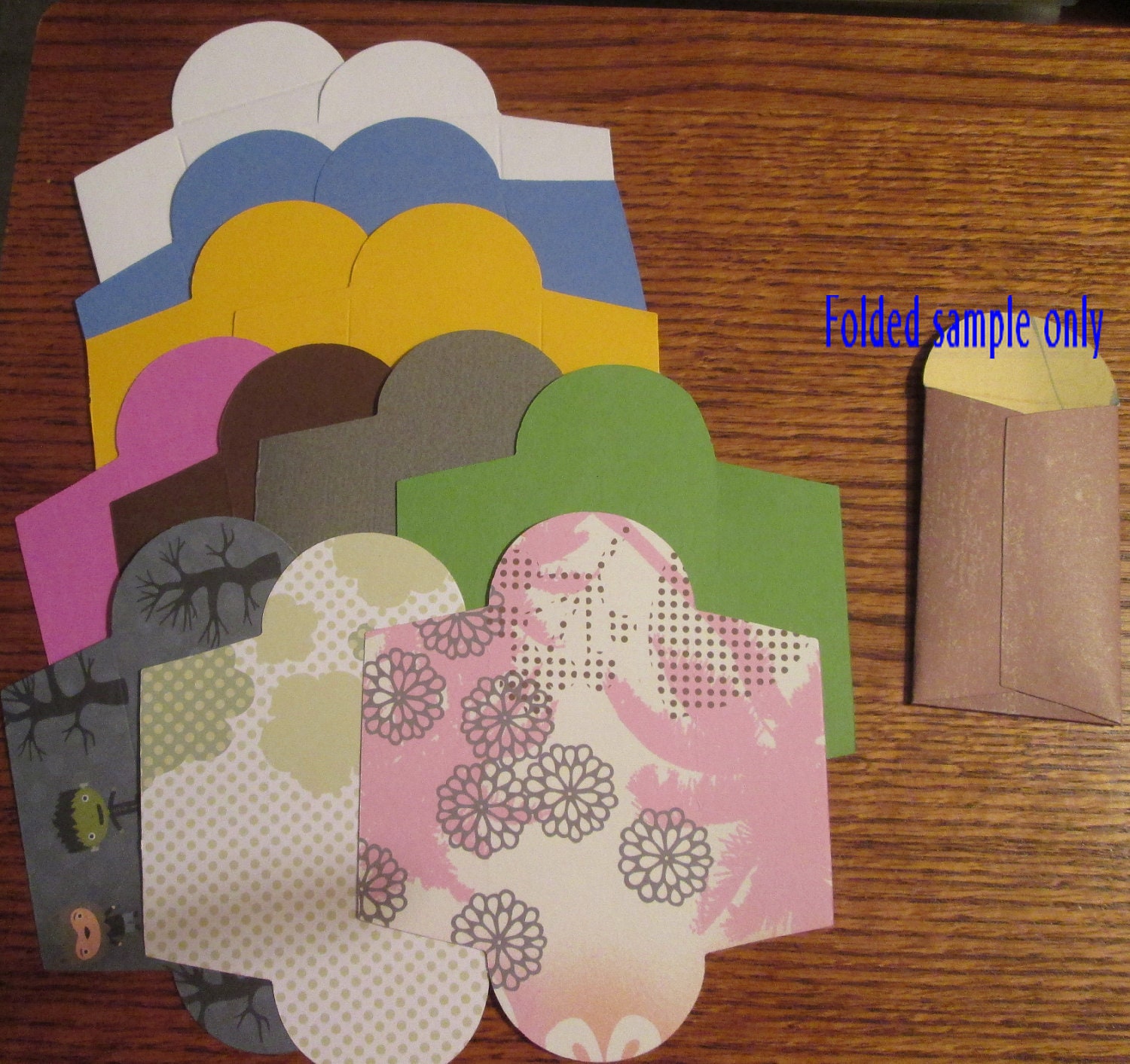 13 Miniature seed packet envelopes. Scored 1 3/4 x 3 inches.