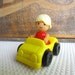 Vintage Toy Woman Figure in Yellow Car made in Hong Kong