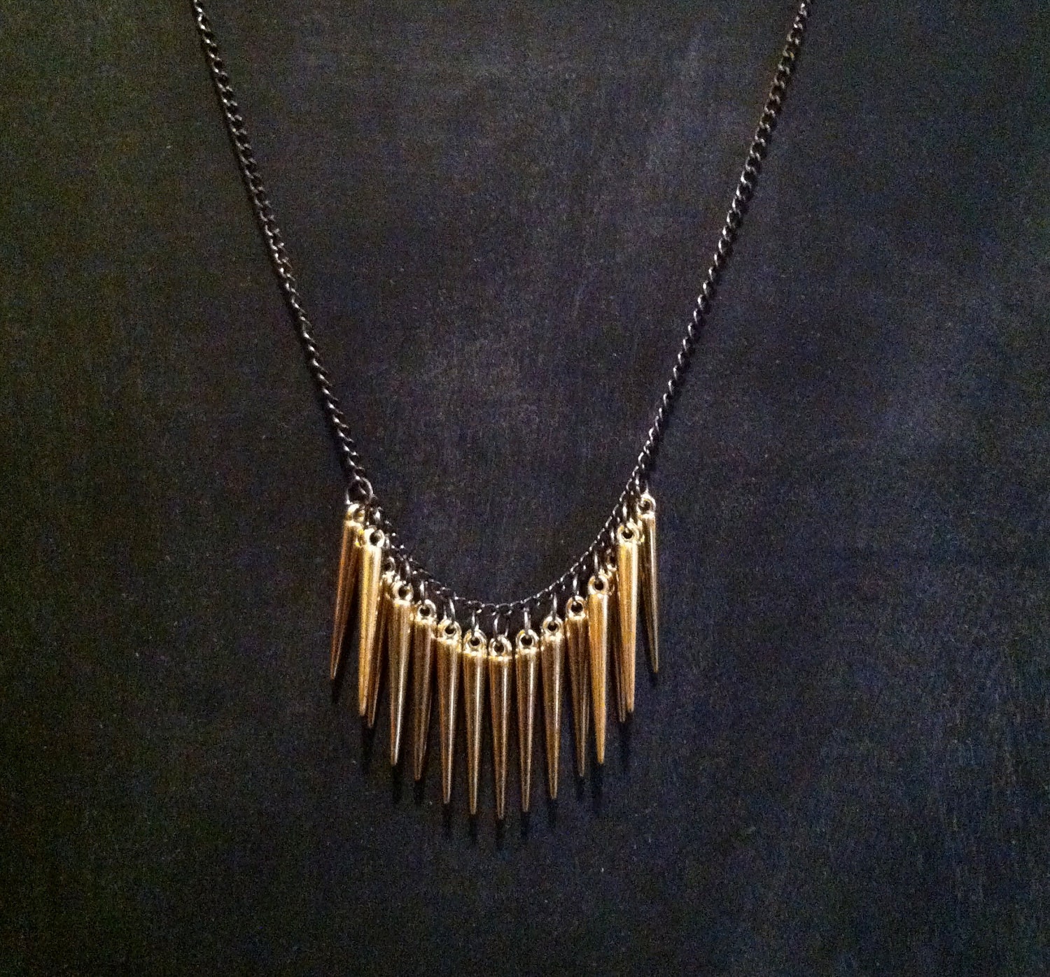 gold spike black necklace