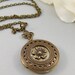 Symphony in Bloom,Locket,Flower,Brass Locket,Brass Necklace,Floral,Flower Locket,,Antique Locket. Handmade jewelry by valleygirldesigns.