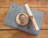 Vintage Glass Photo Paperweight and French Grammar Review Book Vignette
