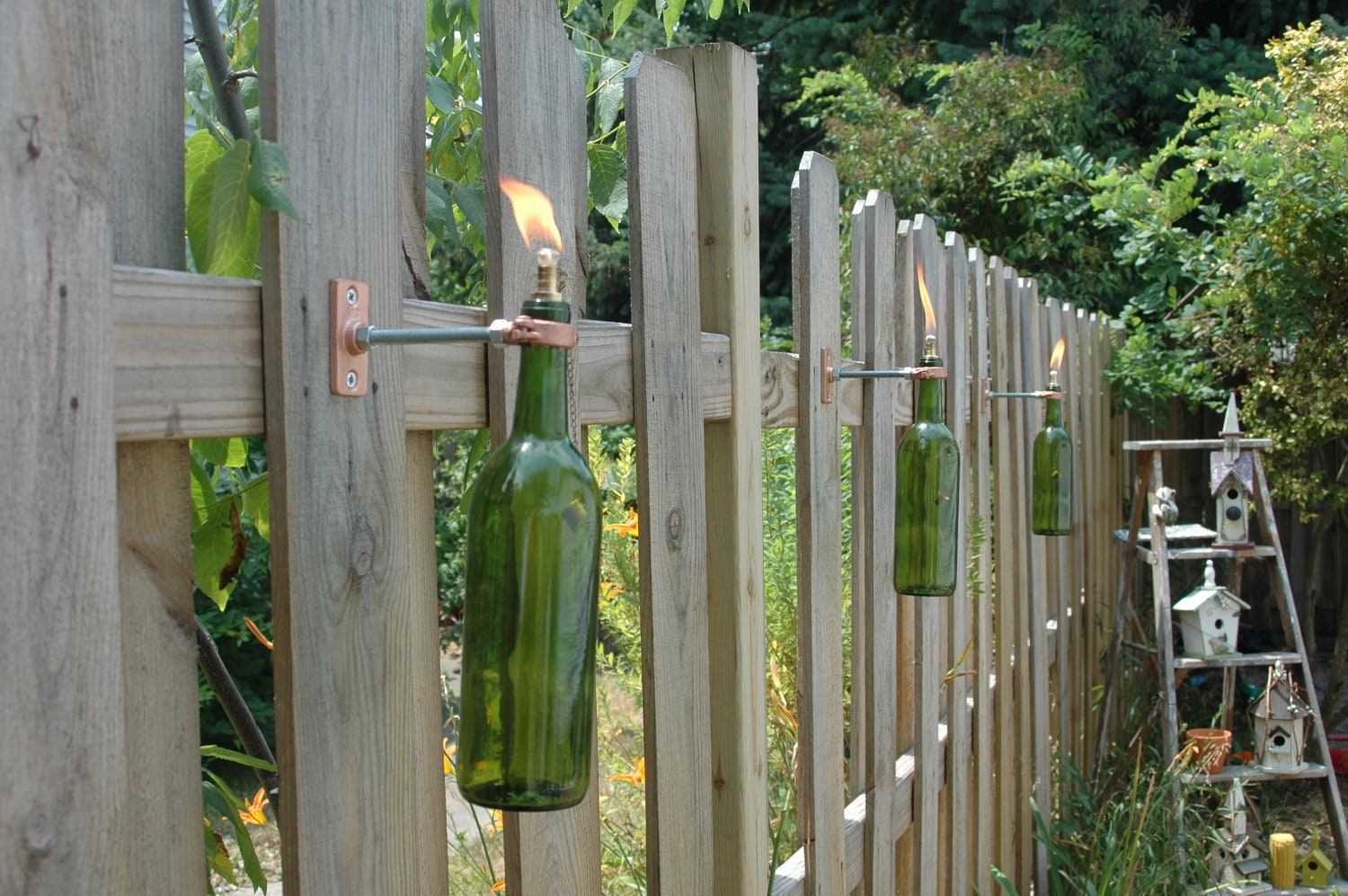 4 Wine Bottle Tiki Torches in your color choice of Red, Cobalt Blue, Frosted White, Green or Amber