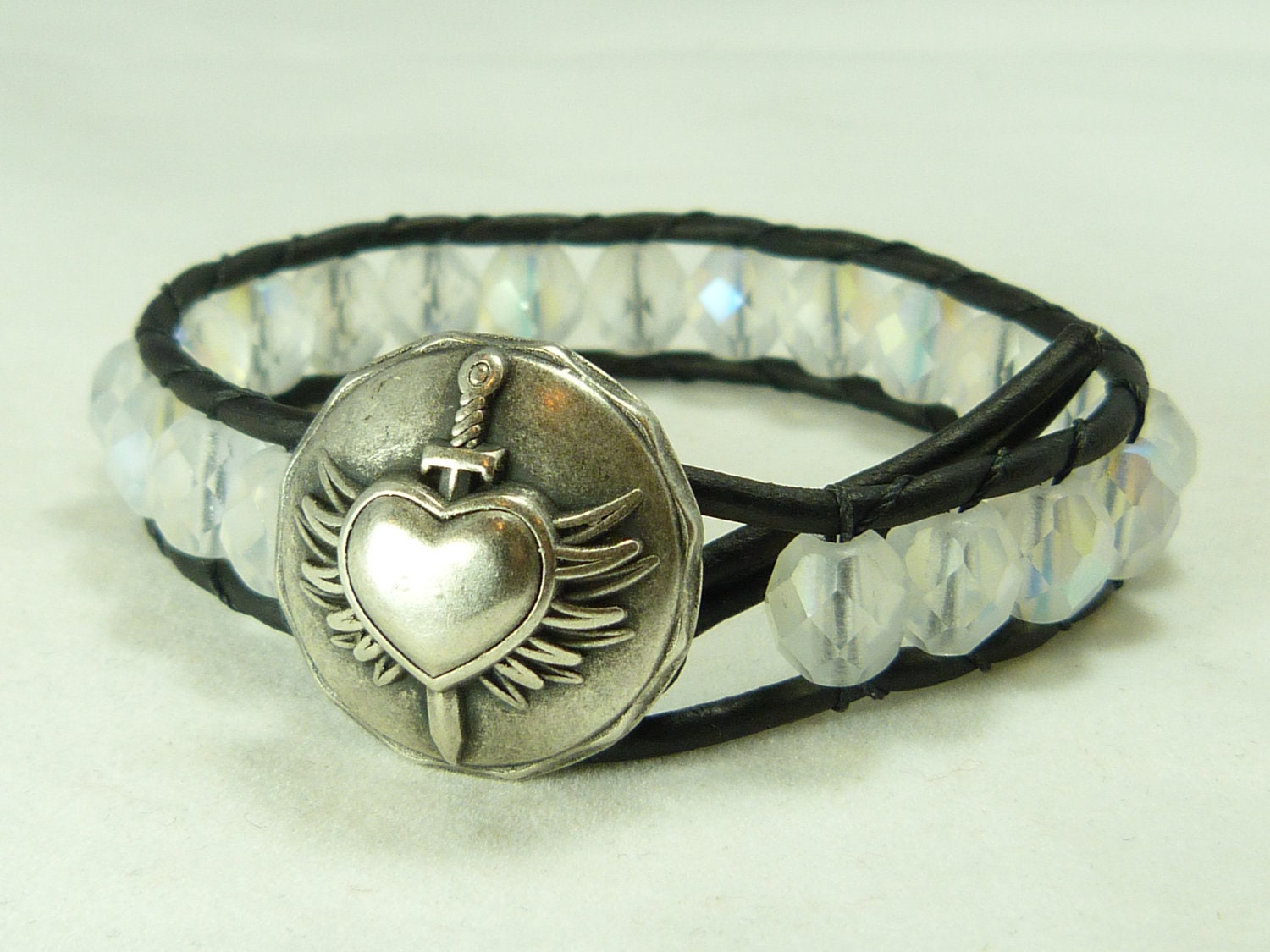 Leather wrap bracelet, gorgeous Czech beads on distressed black leather, with winged heart closure. Rocker, glam look.