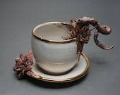 Bottom Feeder Tea Cup and Saucer, two