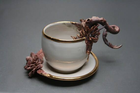 Bottom Feeder Tea Cup and Saucer, two