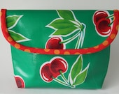 JENNA Oilcloth cherry print pouch with polka dot spotty trim.  Emerald green, red, waterproof make up / cosmetic bag / clutch