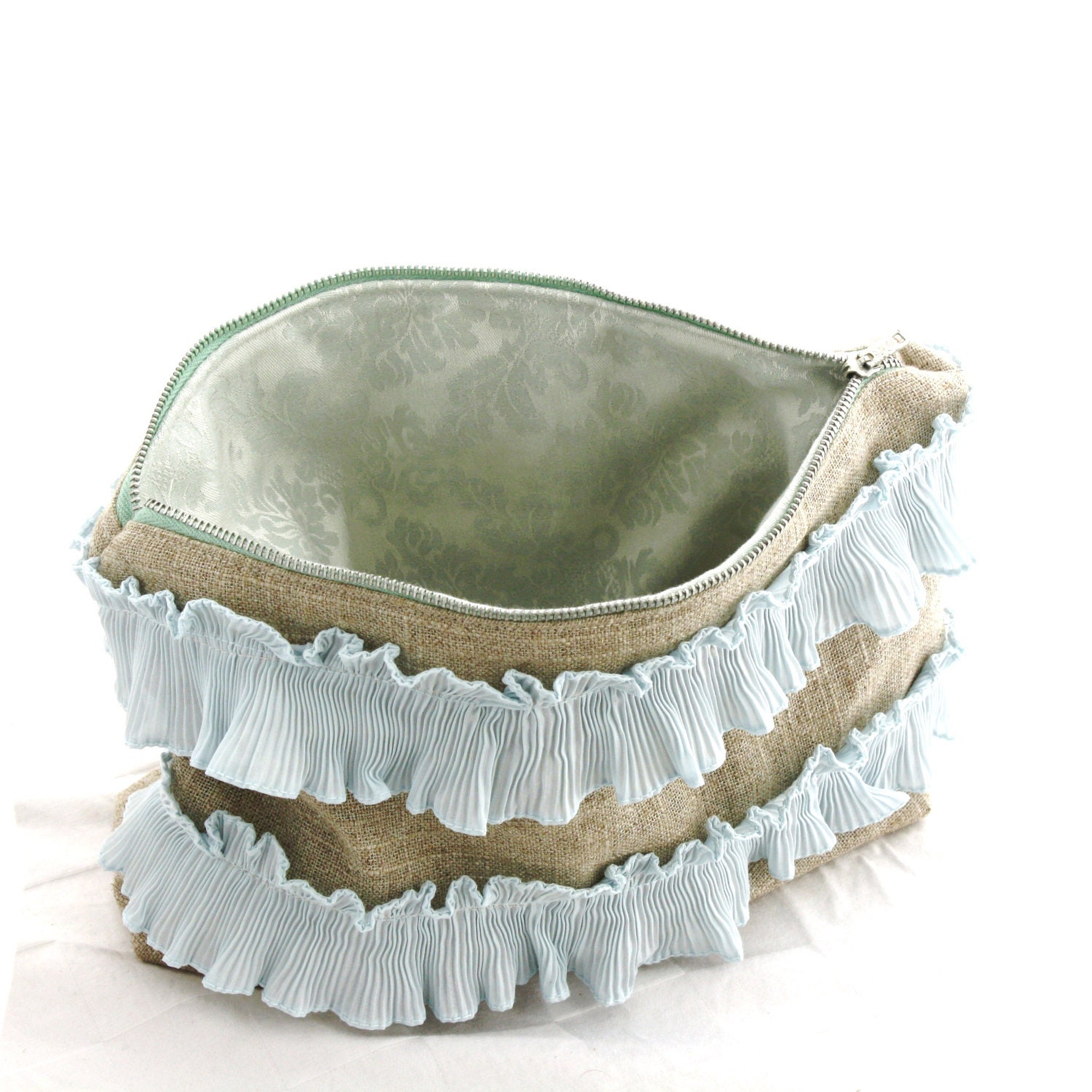 Ruffled costmetic bag with vintage zipper and ruffles on new linen with a silk damask interior. 7 x 10 inches
