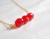 Red necklace gold. Three Czech glass faceted beads in siam red. Gift for her