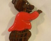 Rare 1940s carved wooden bear with a red bakelite shirt - awesome find
