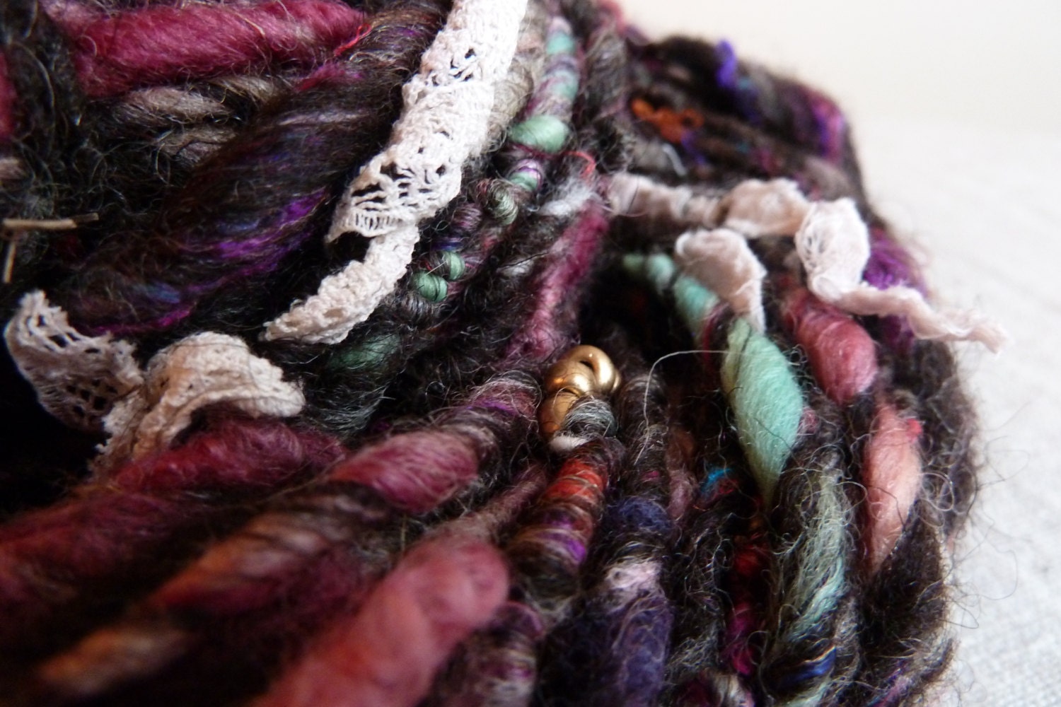 Handspun art yarn with lace and beads