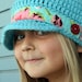 Girl's Aqua Crochet Newsboy Hat with Floral band
