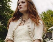 As seen is Oregon Bride Magazine Made to Order Ivory Wool Bridal Shrug with Ruffle Edge and Flowerette