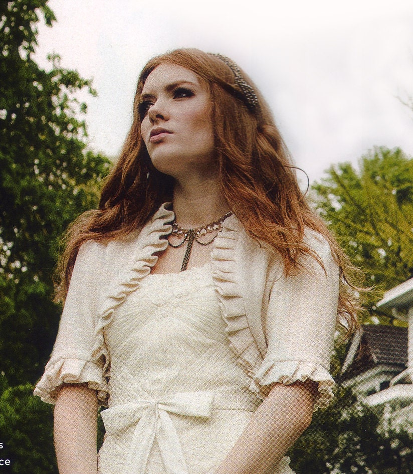 As seen is Oregon Bride Magazine Made to Order Ivory Wool Bridal Shrug with Ruffle Edge and Flowerette