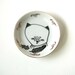 small hand painted plate -cat with feathers