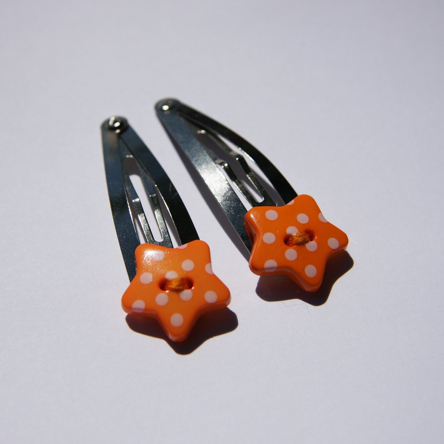 Orange polka dot star buttton hair clips - set of 2