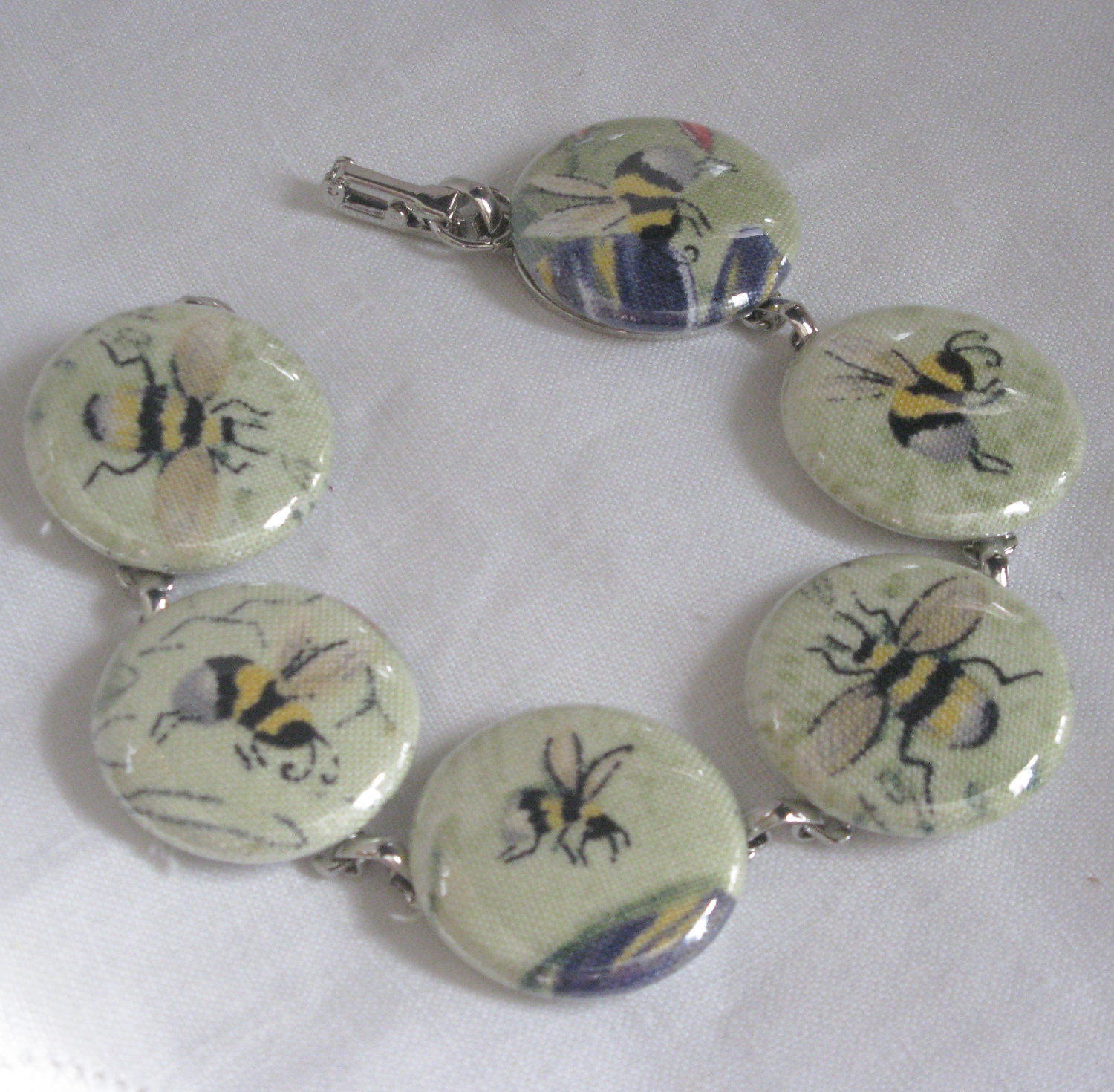 bracelet cute little bee on light green  fabric covered one inch buttons bracelet 8 inches